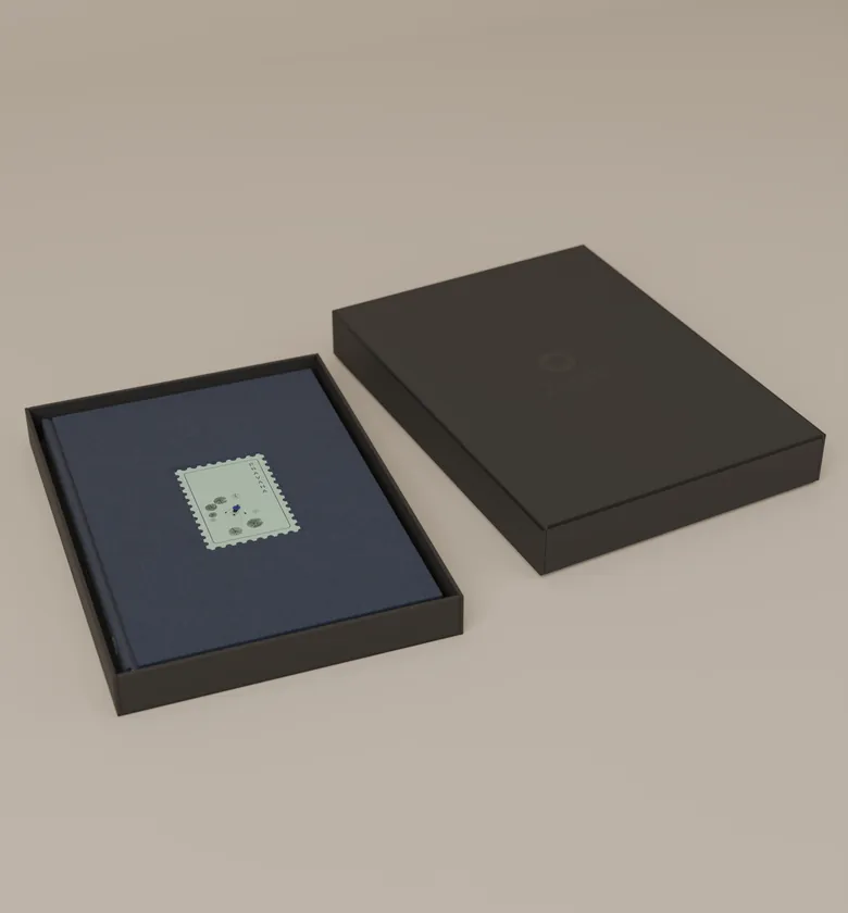 The notebook in its black ZUZU box, the lid beside it